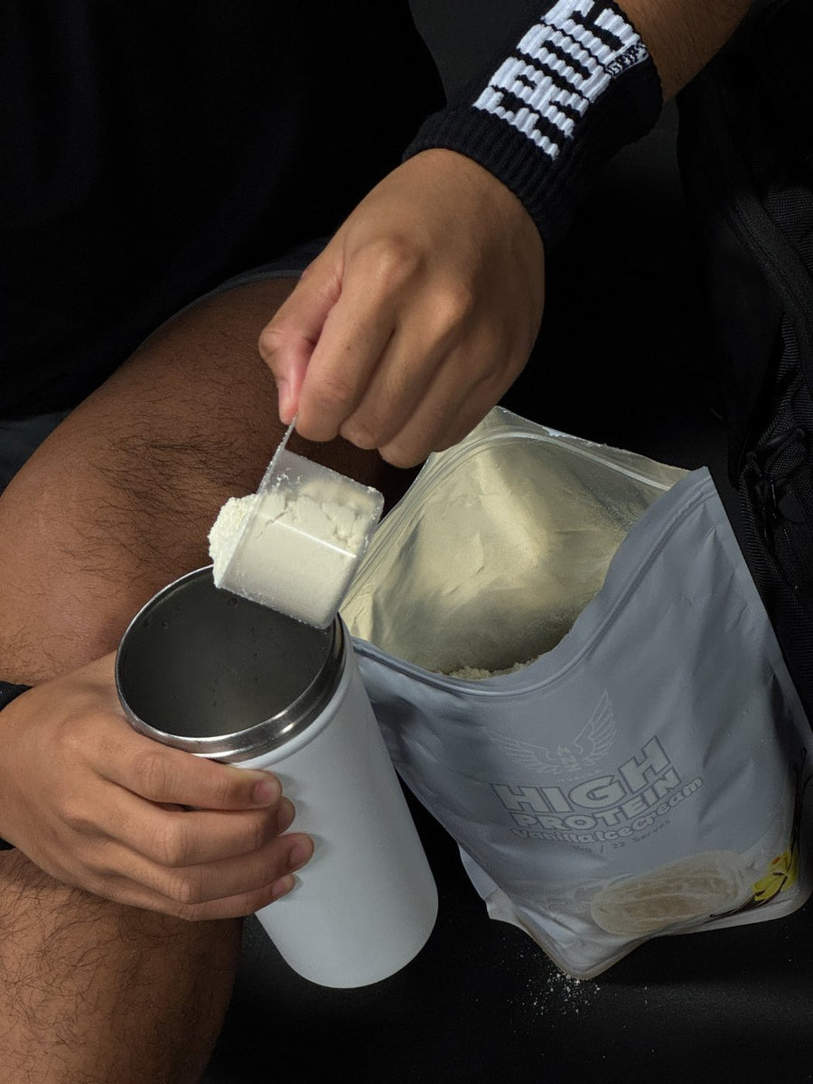 Customer scooping NZ Muscle High Protein
