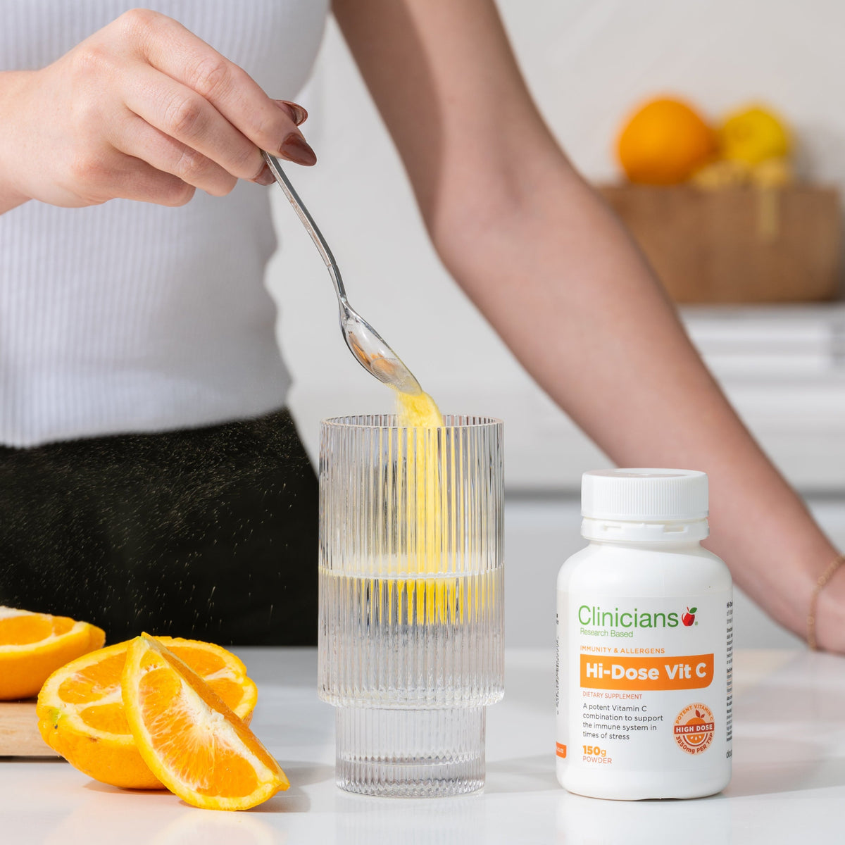 Clinicians Hi-Dose Vitamin C powder mixed into a drink