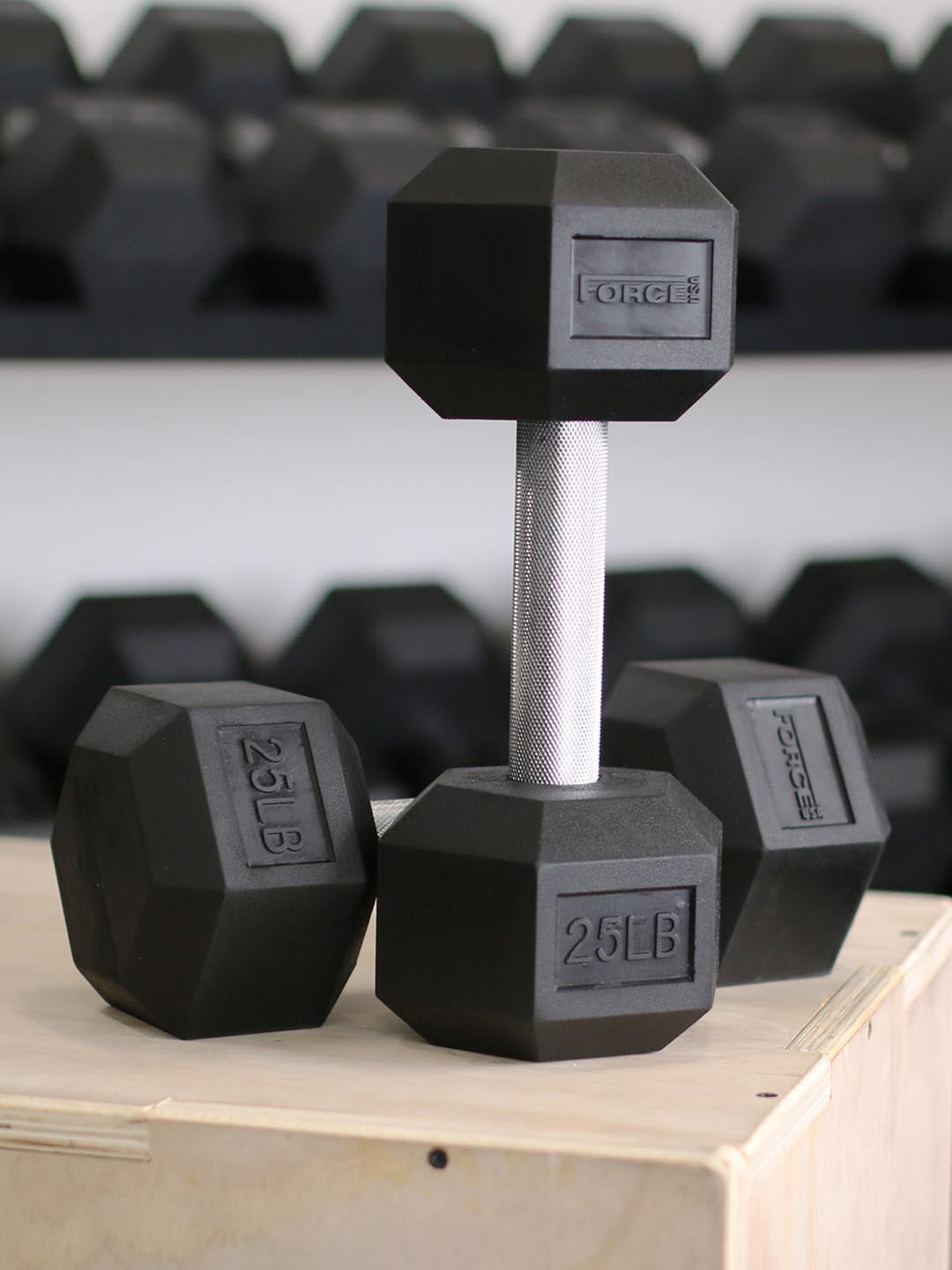 Force USA rubber hex dumbbells in use