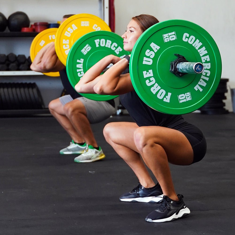 Force USA Pro Grade Bumper Plates loaded on a barbell
