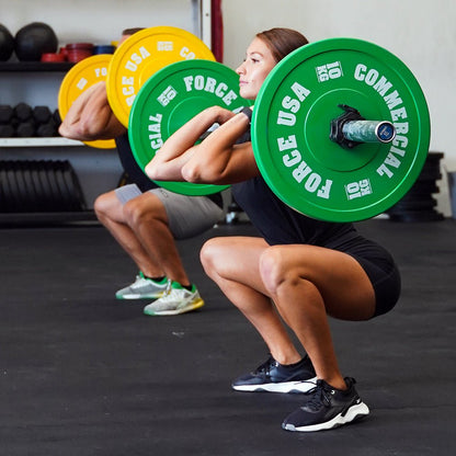 Force USA Pro Grade Bumper Plates loaded on a barbell
